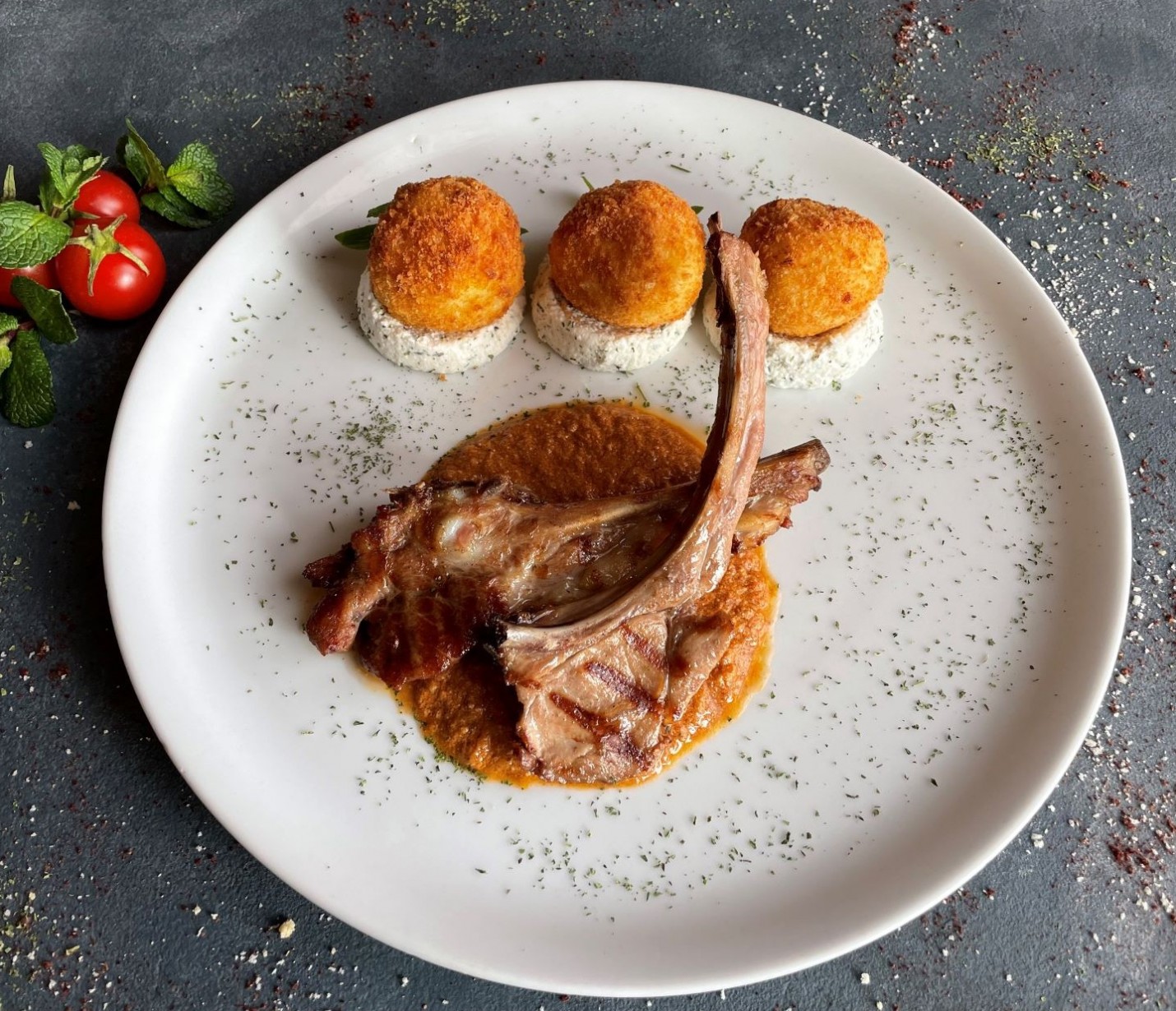 <h6 class='prettyPhoto-title'>FRIED VEAL RIBS WITH BAZHE SAUCE, GHOMI AND SULUGUNI CHEESE</h6>