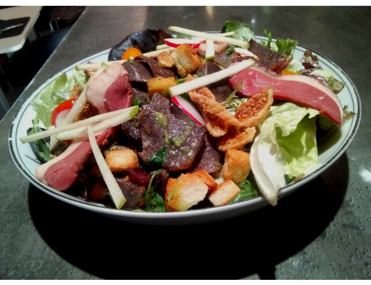 <h3 class='prettyPhoto-title'>Goose gizzard salad and many other delicacies.</h3><br/>Salad of homemade confit goose gizzards, soft figs, small croutons, garlic and parsley, homemade smoked duck breast, vegetable pickles.