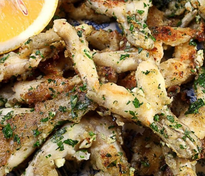 <h6 class='prettyPhoto-title'>Frogs legs with parsley butter</h6>