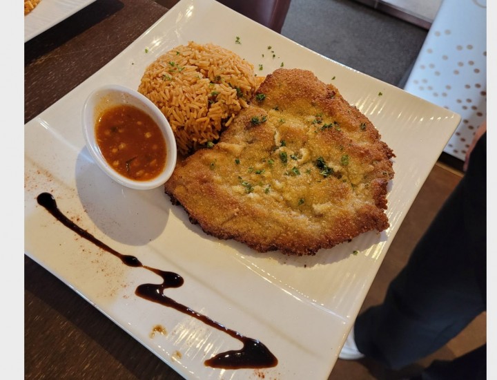 <h6 class='prettyPhoto-title'>Breaded Milanese veal cutlet</h6>