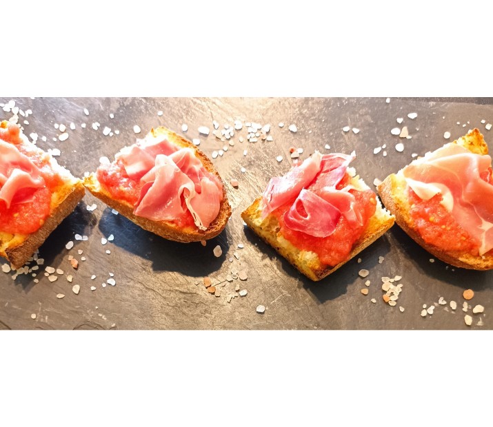 <h3 class='prettyPhoto-title'>Pan con tomato and jamon</h3><br/>Toasted bread covered with a tomato puree, salt, garlic olive oil and ham