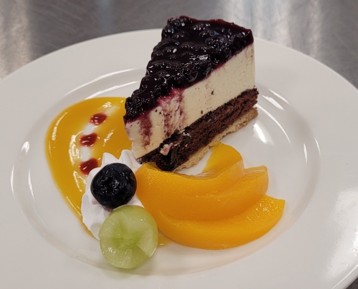 <h6 class='prettyPhoto-title'>Blueberry Cream Cheesecake with Mango Sauce</h6>