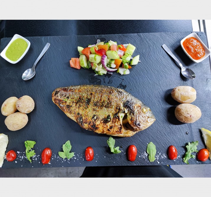 <h6 class='prettyPhoto-title'>Grilled sea bream with wrinkled potatoes and salad</h6>
